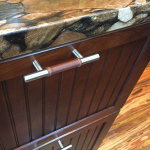 leather-wrapped cabinet pulls!